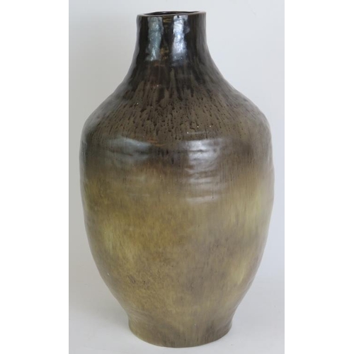 128 - A large studio pottery vase with brown graduated glaze. Signed to base J Maltby, possibly John Maltb... 