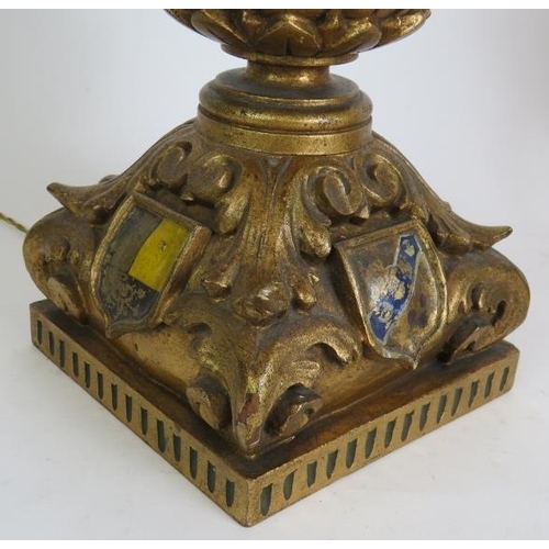 133 - An ornate carved gilt wood and gesso table lamp with acanthus leaf decoration and hand painted armor... 