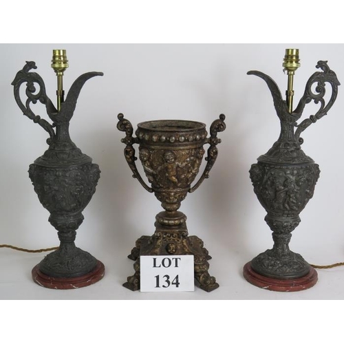 134 - A pair of decorative Spelter classical Greek style ewer lamps ornately decorated with Putti plus a s... 