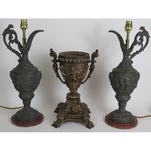 134 - A pair of decorative Spelter classical Greek style ewer lamps ornately decorated with Putti plus a s... 