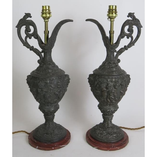 134 - A pair of decorative Spelter classical Greek style ewer lamps ornately decorated with Putti plus a s... 