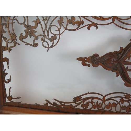 135 - A highly intricate fretwork wooden panel in mahogany frame, 118cm x 40cm.
Condition report: Some bro... 