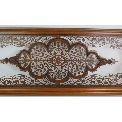 135 - A highly intricate fretwork wooden panel in mahogany frame, 118cm x 40cm.
Condition report: Some bro... 