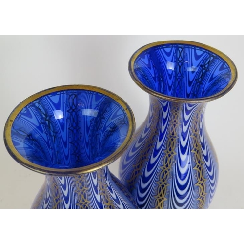 138 - A pair of good quality antique blue and white Venetian style glass vases with gilded decoration and ... 