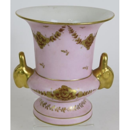 141 - An antique Limoges porcelain pink Campana vase with gilt decoration and a 19th Century covered stone... 