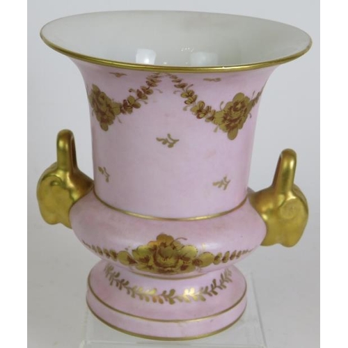 141 - An antique Limoges porcelain pink Campana vase with gilt decoration and a 19th Century covered stone... 