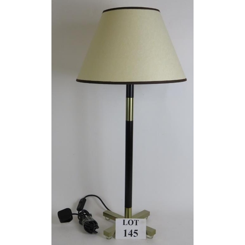 145 - A stylish black and brass table lamp with X base by Heath field lighting. Height 74cm.
Condition rep... 