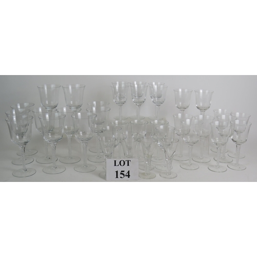 154 - A suite of 38 contemporary air twist drinking glasses to include 11 red wine, 10 white wine, 11 sher... 