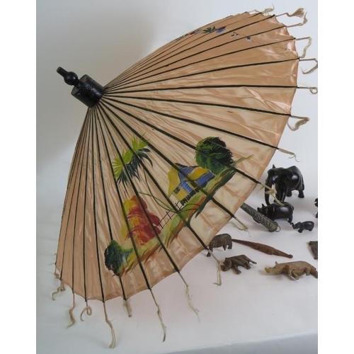 160 - A vintage Far Eastern hand decorated silk parasol with white metal handle and a quantity of hand car... 