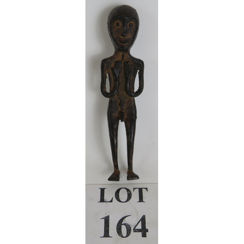 164 - A small bronze Ethnic tribal figure, probably West African, depicting a man with a crocodile symbol ... 