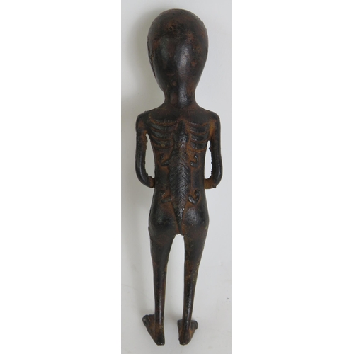 164 - A small bronze Ethnic tribal figure, probably West African, depicting a man with a crocodile symbol ... 