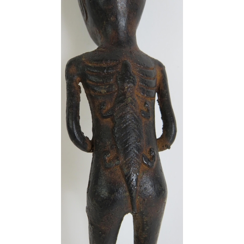 164 - A small bronze Ethnic tribal figure, probably West African, depicting a man with a crocodile symbol ... 