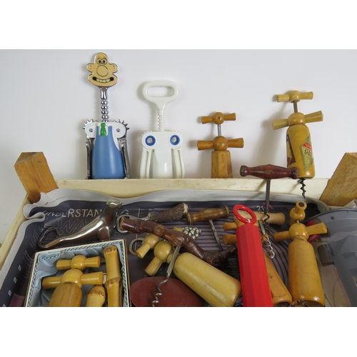 166 - A collection of vintage corkscrews and bottle openers of varying types including a 1960s bamboo hand... 