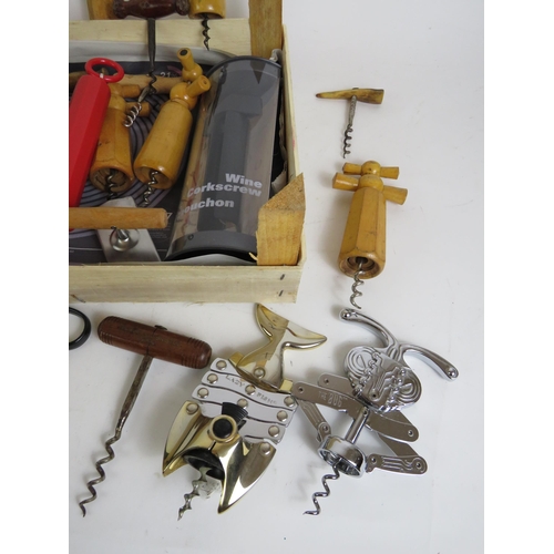 166 - A collection of vintage corkscrews and bottle openers of varying types including a 1960s bamboo hand... 