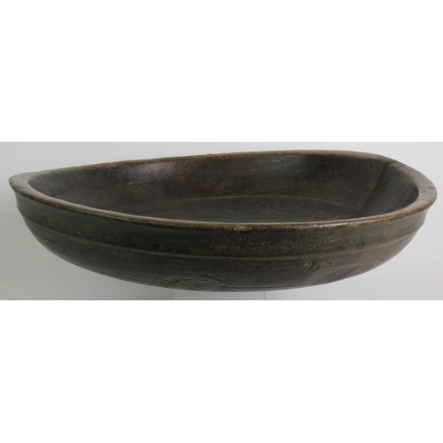 17 - A large antique country oak dairy or dough bowl with turned rim and aged patination. Max diameter 52... 