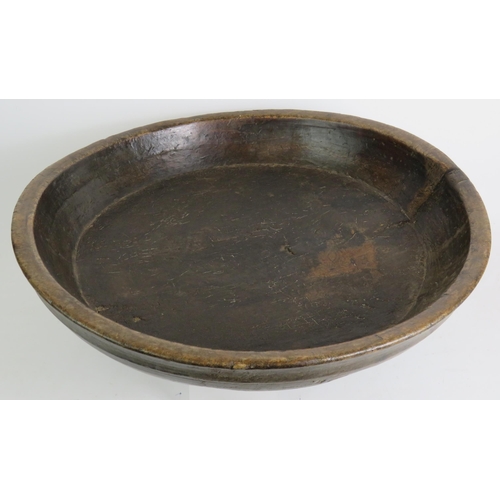 17 - A large antique country oak dairy or dough bowl with turned rim and aged patination. Max diameter 52... 