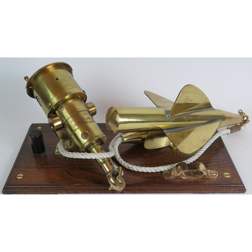 173 - An antique brass Walker's Cherub Mark II ship's log and spinner mounted on a polished oak base. Leng... 