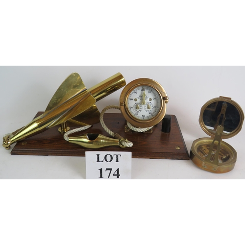 174 - An antique brass Walker's Cherub Mark III ship's log and spinner mounted on a polished oak base, plu... 