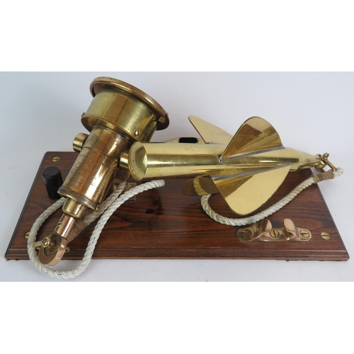 174 - An antique brass Walker's Cherub Mark III ship's log and spinner mounted on a polished oak base, plu... 