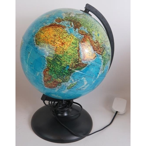 179 - Three contemporary terrestrial globe lights, each 36cm tall. (3).
Condition report: One with scuff m... 