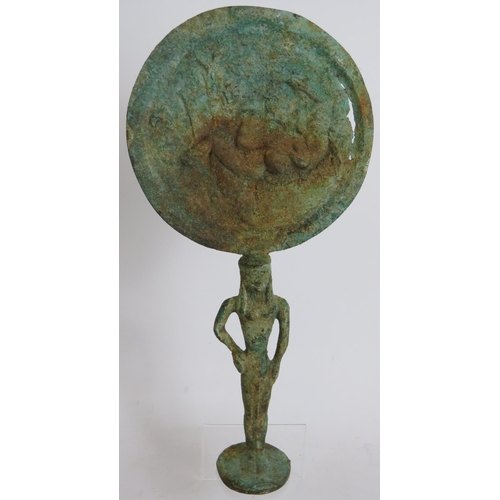 18 - An Etruscan style bronze mirror possible Archaic, formed from an open armed figural handle supportin... 