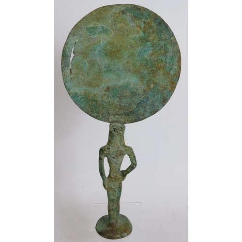 18 - An Etruscan style bronze mirror possible Archaic, formed from an open armed figural handle supportin... 