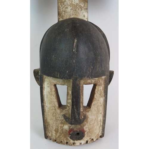 2 - An early/mid 20th Century Mali Dogon tribal Kanaga mask decorated in black, white and red, the rever... 