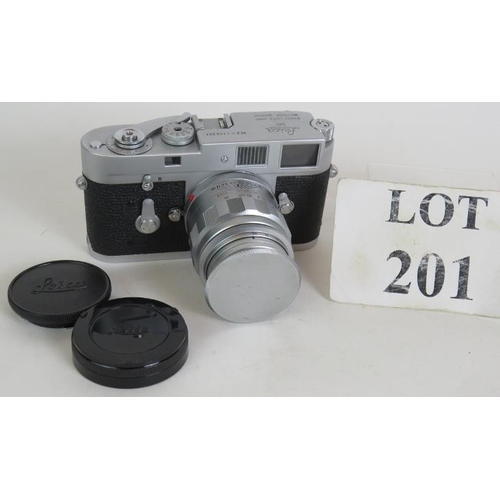 201 - A Leica M2 camera No 1113241 circa 1965 with 90mm F2.8 Lettz lens and covers.
Condition report: Ligh... 