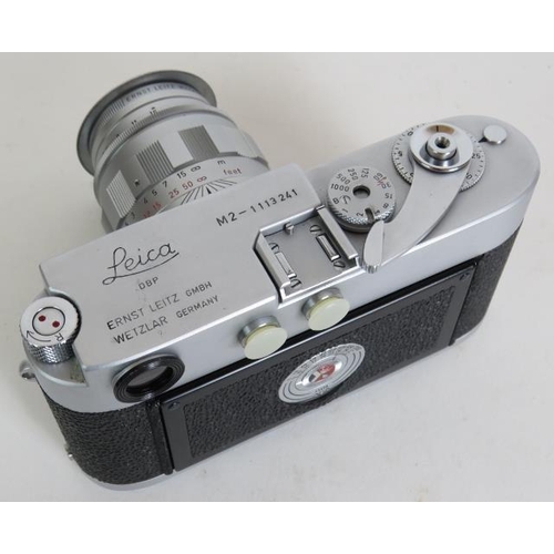 201 - A Leica M2 camera No 1113241 circa 1965 with 90mm F2.8 Lettz lens and covers.
Condition report: Ligh... 