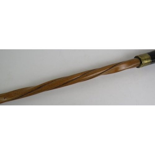 21 - An antique Wrythen shafted walking stick with percussion muff pistol handle, c1820. The octagonal ba... 