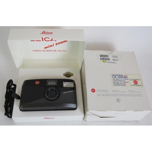 214 - A Leica mini-zoom 35-70mm compact camera with original packaging and a Rollei 35 compact 35mm camera... 