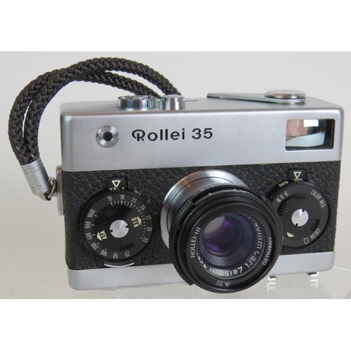 214 - A Leica mini-zoom 35-70mm compact camera with original packaging and a Rollei 35 compact 35mm camera... 