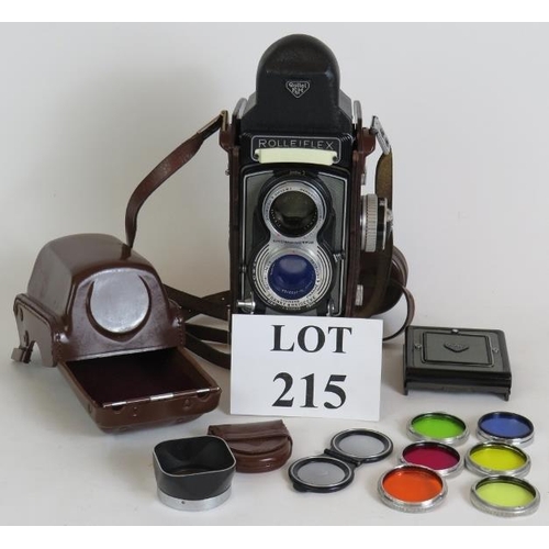 215 - A Rolleiflex T model 1 TLR camera with 75mm F3.5 Zeiss lenses, leather case, filters and pentaprism ... 