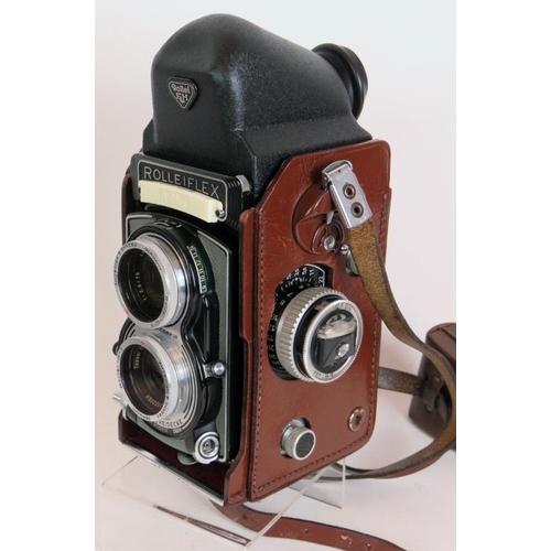 215 - A Rolleiflex T model 1 TLR camera with 75mm F3.5 Zeiss lenses, leather case, filters and pentaprism ... 