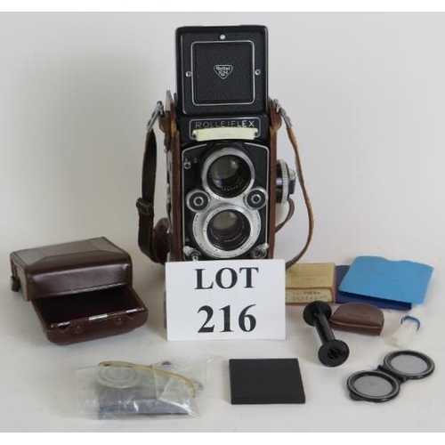 216 - A Rolleiflex 3.5 F model 3 No 2853194 TLR camera with 75mm F2.8 Xenotar lenses, leather case and acc... 