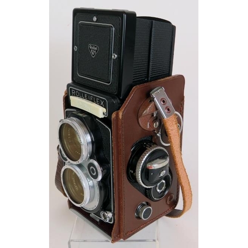 216 - A Rolleiflex 3.5 F model 3 No 2853194 TLR camera with 75mm F2.8 Xenotar lenses, leather case and acc... 