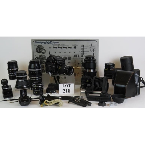 218 - A Mamiya 645 1000S camera No L153212 plus seven lenses, bellows, grips, viewfinders and various othe... 