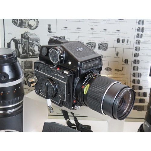 218 - A Mamiya 645 1000S camera No L153212 plus seven lenses, bellows, grips, viewfinders and various othe... 