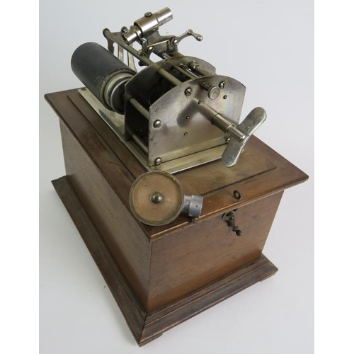 26 - An antique cylinder phonograph in mahogany case with an Amplion horn.
Condition report: Winds and pl... 