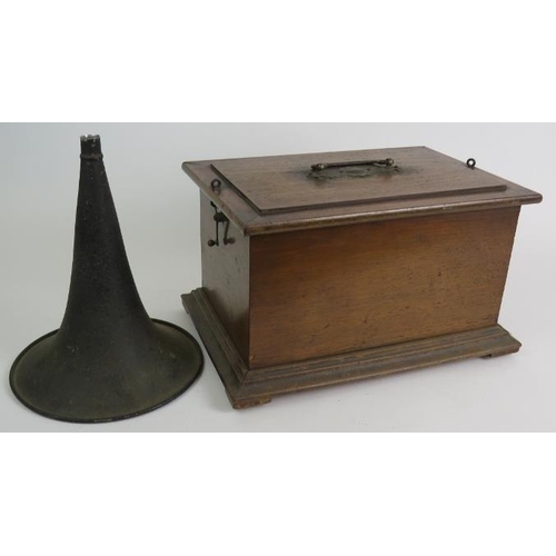 26 - An antique cylinder phonograph in mahogany case with an Amplion horn.
Condition report: Winds and pl... 