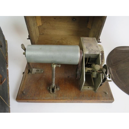 28 - A cylinder phonograph mechanism in wooden case, a steel horn and quantity of wax cylinders. 
Conditi... 