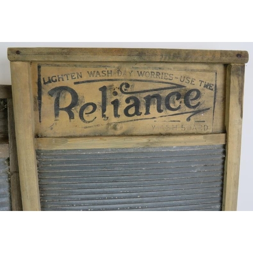 30 - Two vintage wood and zinc washboards one by Reliance and a carved wooden bread board. (3).
Condition... 