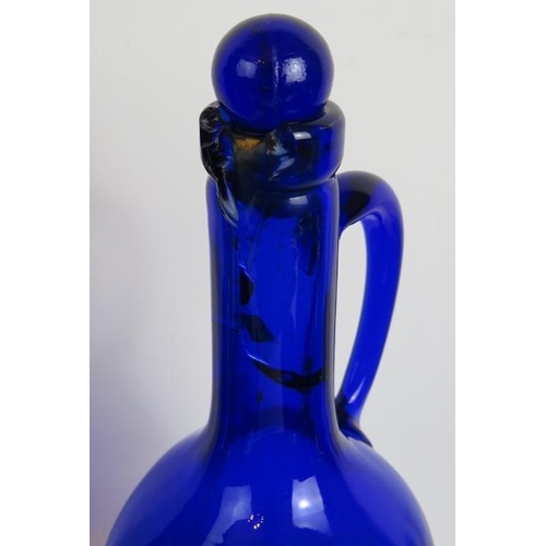 38 - 22 pieces of mainly antique Bristol blue glass including 2 gilded decanters, a decorated rolling pin... 