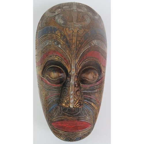 4 - A hand carved Maori Koruru mask with carved tattoo design and polychrome decoration, probably late 1... 