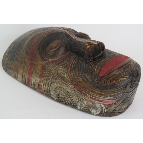 4 - A hand carved Maori Koruru mask with carved tattoo design and polychrome decoration, probably late 1... 