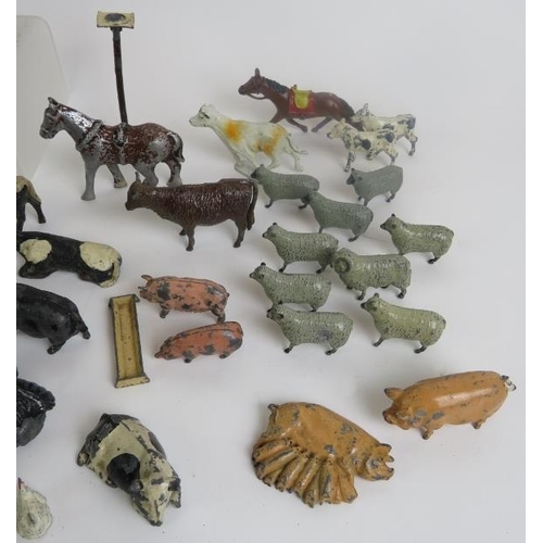 45 - A large quantity of Diecast animals and figures, C1950s, some marked 'Britains'.
(qty).
Condition re... 