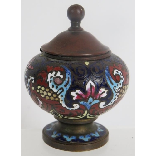 46 - An antique bronze inkwell decorated with champlevé enamelled scrollate motifs. Height 7.5cm.
Conditi... 