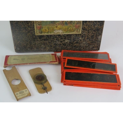 48 - An antique German Magic Lantern by Ernst Plank, in original box with a quantity of glass slides and ... 