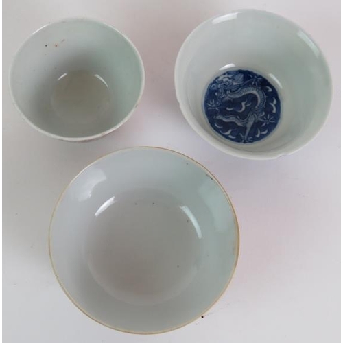 49 - Three antique Chinese porcelain bowls, one blue and white depicting a five claw dragon chasing a pea... 