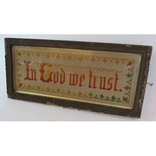 50 - A late 19th Century needlework religious epitaph 'In God We Trust' stitched in red and gold within a... 